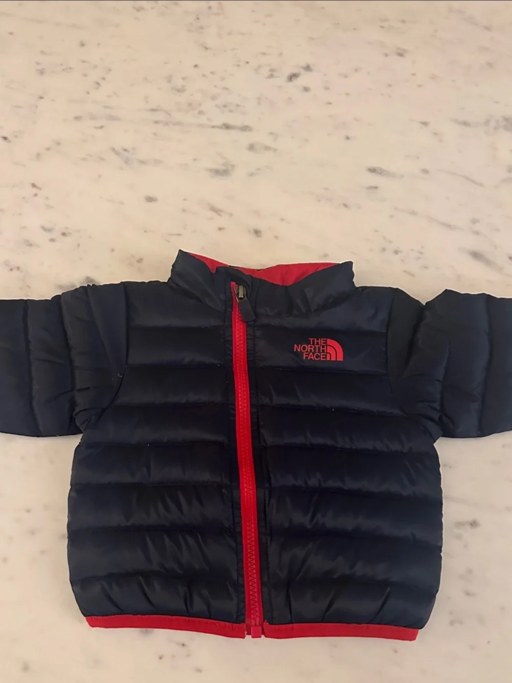 The North Face Navy Puffer Jacket with Red Accents